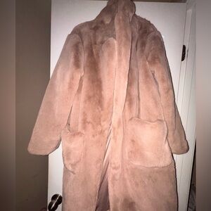 Champagne pink faux fur coat with satin interior, pockets, and button